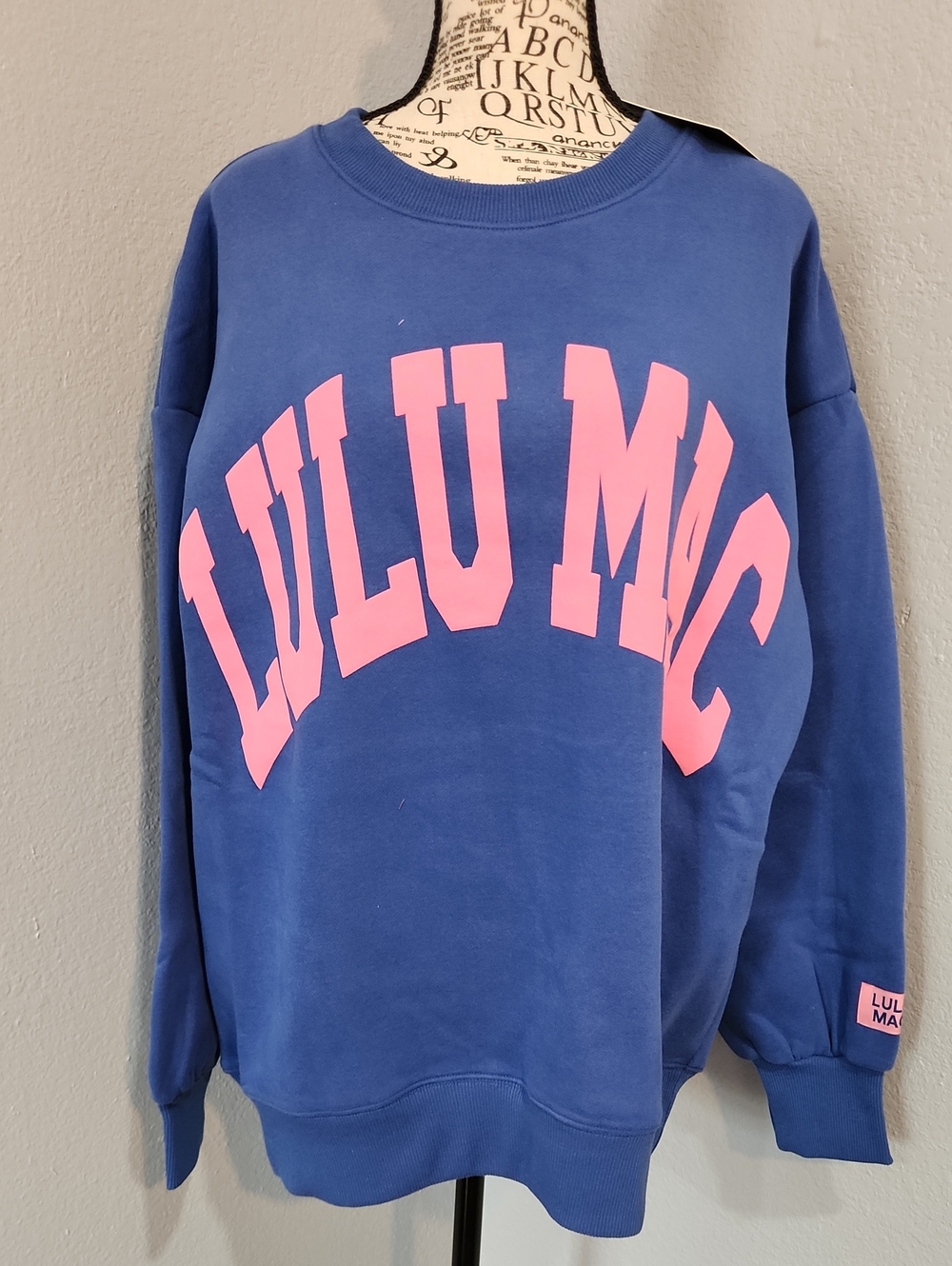 Lulu Mac Blue Sweatshirt with Pink Logo.
